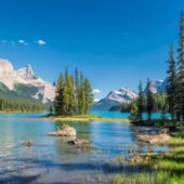Clear blue lake and snow capped peaks in Jasper National Park